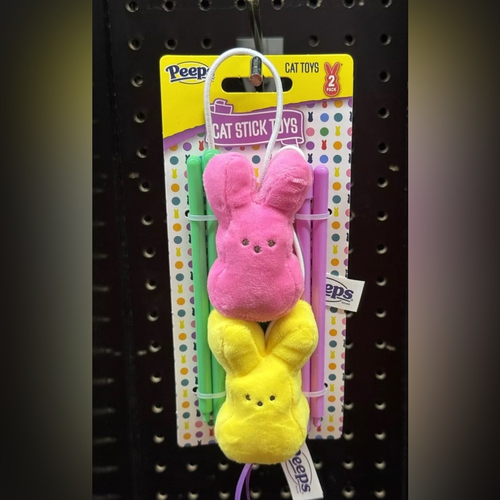 Peeps Cat Stick Toys with two Peeps that are yellow and pink
